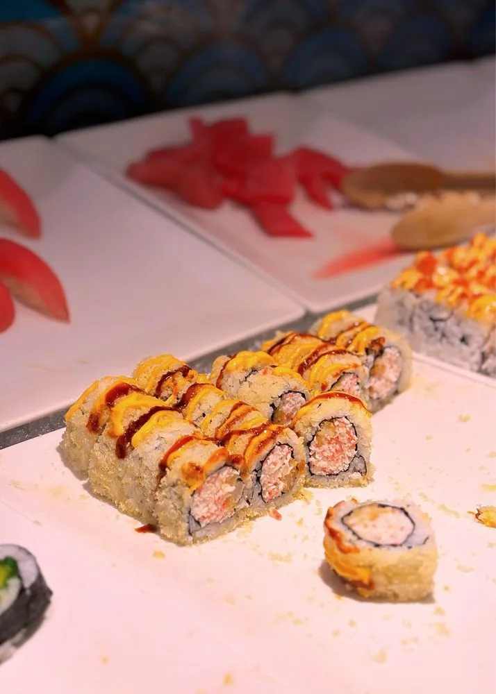 Crunchy tempura sushi rolls topped with spicy mayo and eel sauce